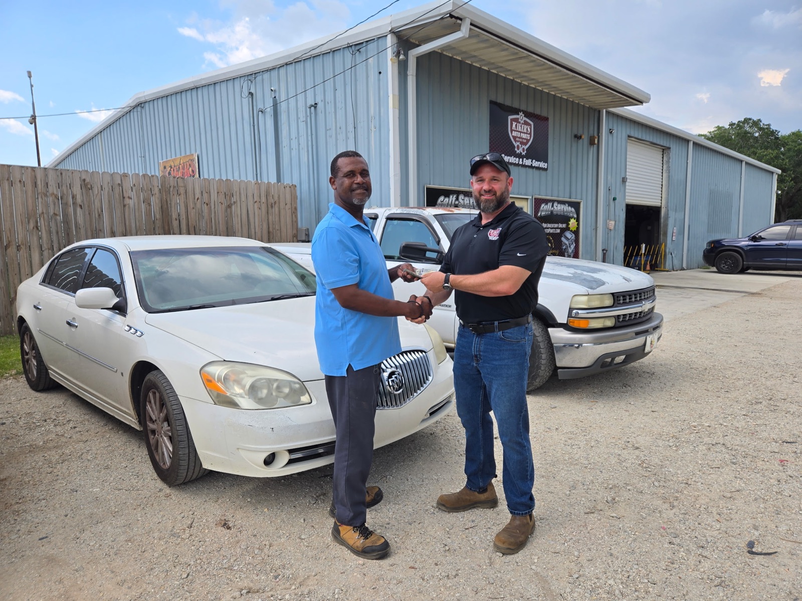 Kiker's completing a cash vehicle pickup for a local customer