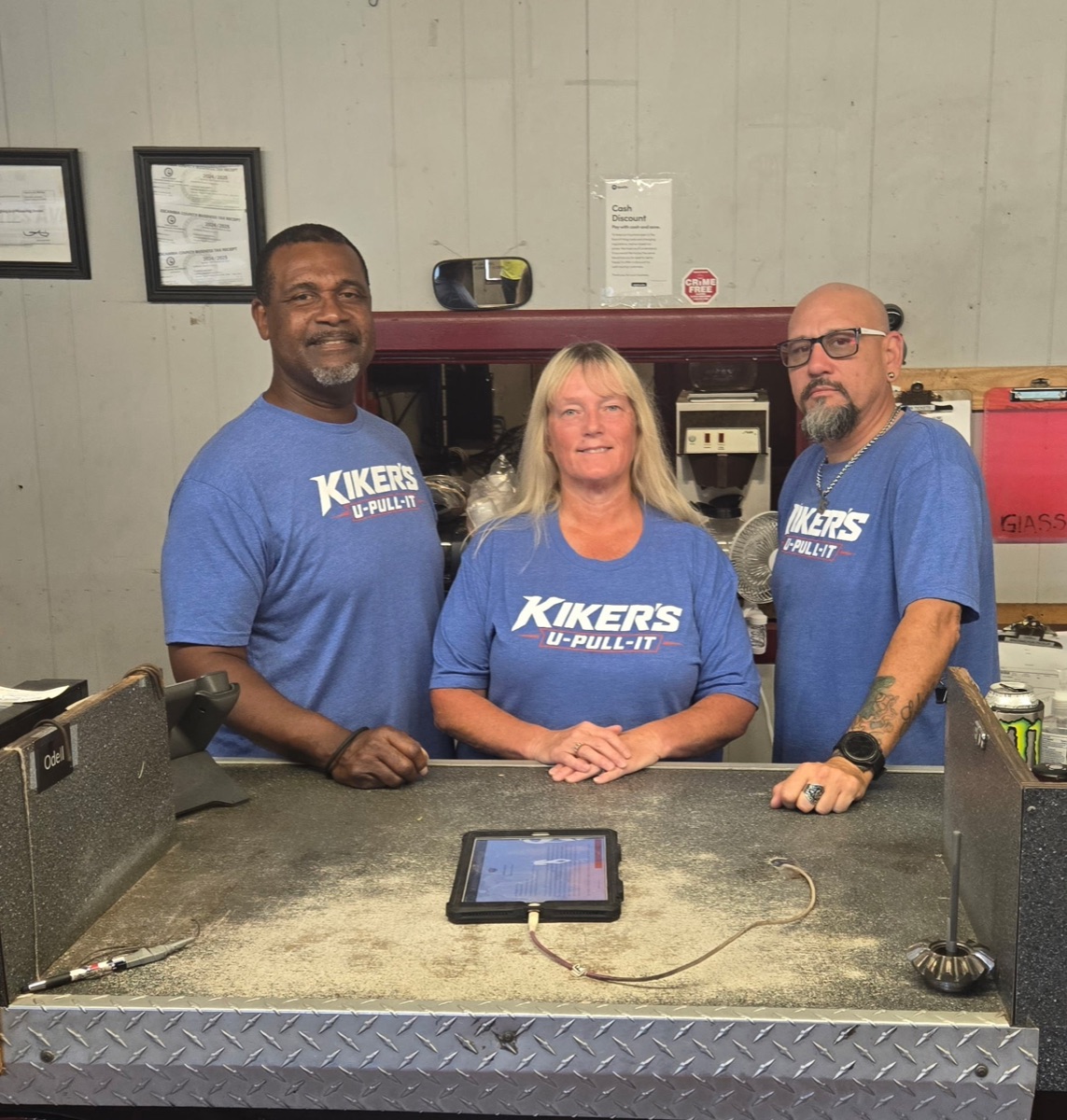 Three members of the Kiker's team at the parts counter