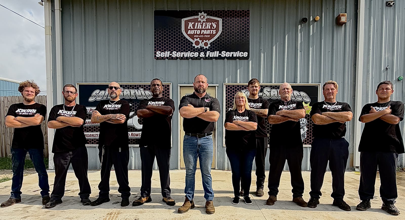 The Kiker's team together outside the Pensacola yard