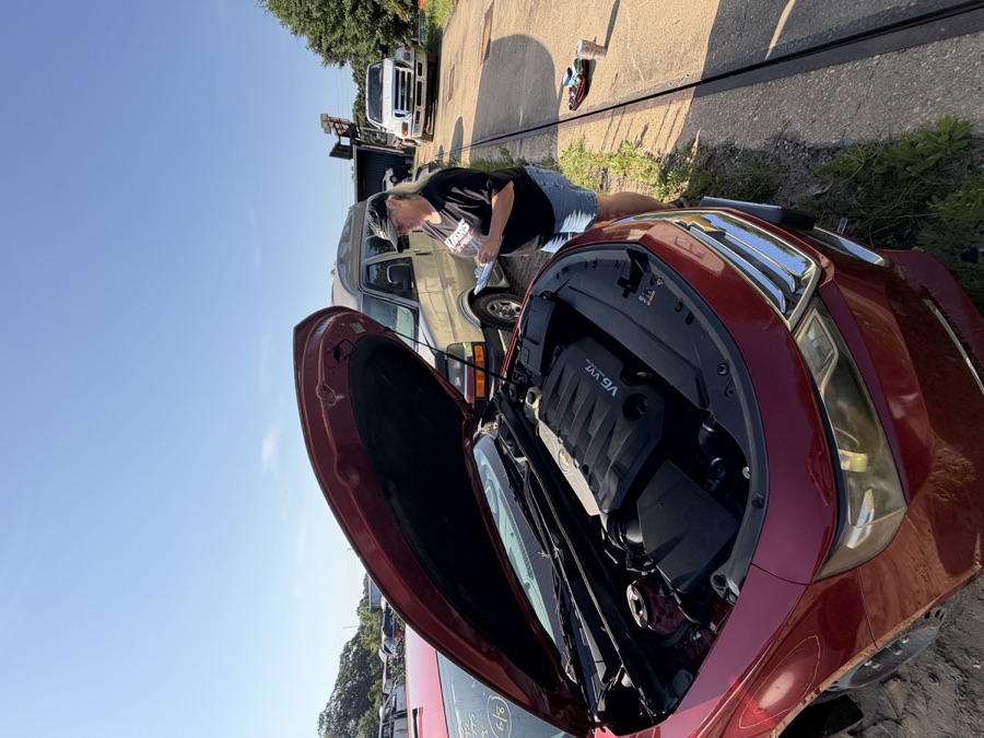 Kiker's team member documenting a vehicle during inspection