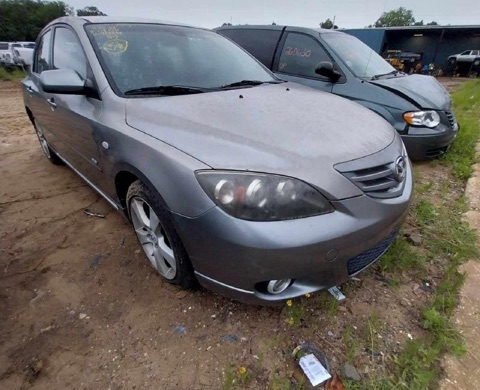 2006 Mazda 3 in the Kiker's yard